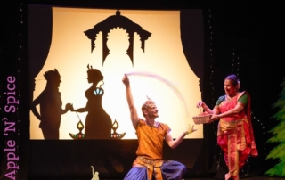 Dancers on stage, with shadow dancers behind